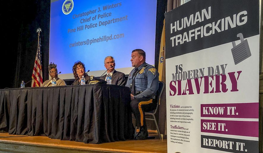 FILE — In this Jan. 24, 2020 file photo, panelists at the New Jersey attorney general's annual human trafficking awareness event talk about how to prevent the crime, in Trenton, N.J. After failing for five years to fully carry out a state anti-human trafficking law, New Jersey officials made good on a promise last year to reinvigorate the commission tasked with preventing the crime. (AP Photo/Mike Catalini, File)