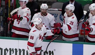 Carolina Hurricanes&#x27; Teuvo Teravainen (86) celebrates with Andrei Svechnikov (37), Vincent Trocheck (16), Sebastian Aho (20) and Warren Foegele, right rear, after Teravainen scored during the second period of the team&#x27;s NHL hockey game against the Dallas Stars in Dallas, Saturday, Feb. 13, 2021. (AP Photo/Tony Gutierrez)