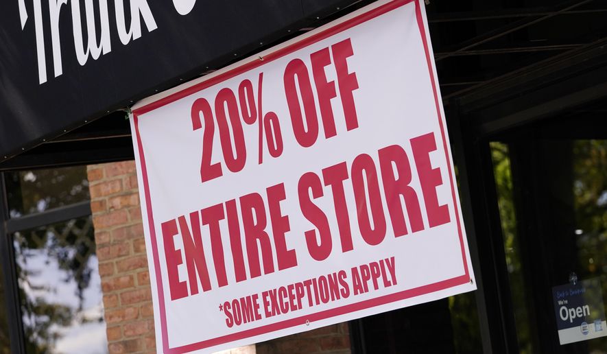 This Oct. 1, 2020 photo shows a sale sign is posted outside a store in Nashville, Tenn. There are now multiple layers of tax benefits for small business owners who took advantage of the Paycheck Protection Program. Business owners can claim otherwise deductible expenses, even if they were paid using PPP loan funds. (AP Photo/Mark Humphrey)