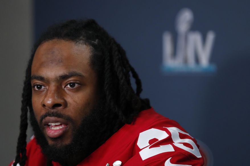 FILE - In this Jan. 30, 2020 file photo San Francisco 49ers cornerback Richard Sherman speaks during a media availability in Miami, for the NFL Super Bowl 54 football game against the Kansas City Chiefs. Sherman has partnered with the NFL Alumni Association (NFLA) and Million Stories Media as part of the Million Stories initiative. The partnership emphasizes engagement in financial literacy education to prepare for future job loss or career changes. (AP Photo/Wilfredo Lee, file)