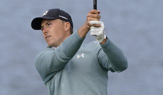 Jordan Spieth follows his shot from the seventh tee of the Pebble Beach Golf Links during the third round of the AT&amp;amp;T Pebble Beach Pro-Am golf tournament Saturday, Feb. 13, 2021, in Pebble Beach, Calif. (AP Photo/Eric Risberg)
