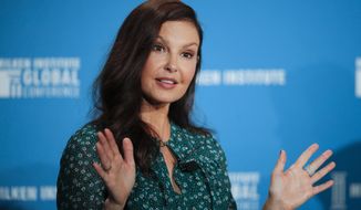 FILE - In this April 30, 2018, file photo, actress Ashley Judd speaks during a discussion on feminism at the Milken Institute Global Conference in Beverly Hills, Calif. Judd has recounted a painful ordeal that she believes almost cost her leg after tripping in a Congolese rainforest and having to be evacuated by motorbike. In one of two Instagram Live videos hosted Friday, Feb. 12, 2021, by New York Times columnist Nicholas Kristof, the actor said she was stuck on the ground for five hours with a “badly misshapen leg,” biting a stick because of pain, and “howling like a wild animal.” (AP Photo/Jae C. Hong, File)