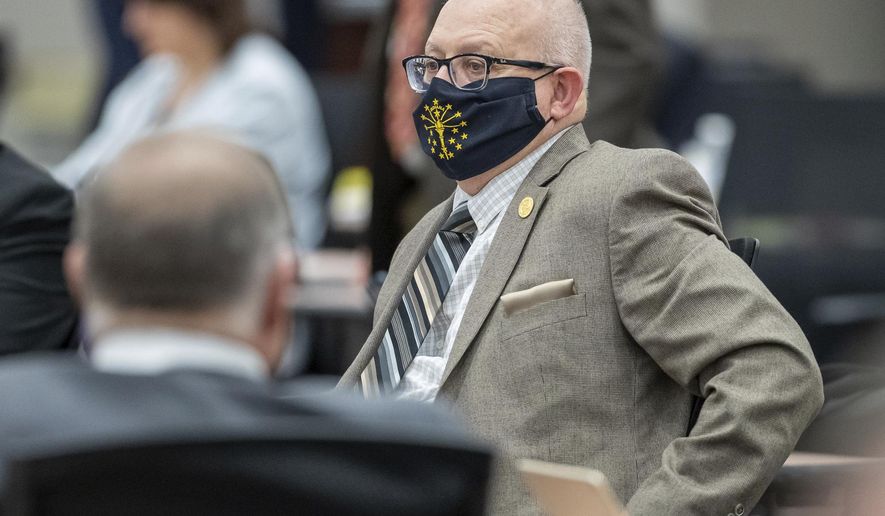 Rep. Doug Miller sits at his desk as the Indiana House meets on Monday, Feb. 8, 2021, inside the temporary chamber at the Government Center South in Indianapolis. Public notices in newspapers about local government actions could disappear or be greatly scaled back under proposals that Indiana legislators are considering. (Mykal McEldowney/The Indianapolis Star via AP)