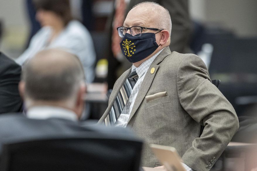 Rep. Doug Miller sits at his desk as the Indiana House meets on Monday, Feb. 8, 2021, inside the temporary chamber at the Government Center South in Indianapolis. Public notices in newspapers about local government actions could disappear or be greatly scaled back under proposals that Indiana legislators are considering. (Mykal McEldowney/The Indianapolis Star via AP)