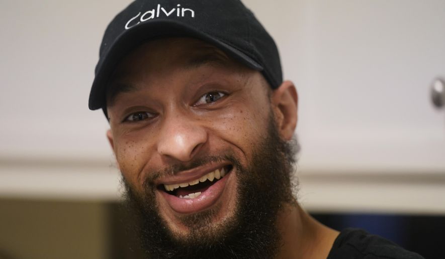 Richard Coleman II poses in his home in Richmond, Va., Thursday, Feb. 11, 2021. Coleman said he was asked to leave four jobs and was taken out of the running for at least six others because of his convictions for possessing a fraction of an ounce of marijuana, once as a college student in 2003 and a second time a few years later. (AP Photo/Steve Helber)