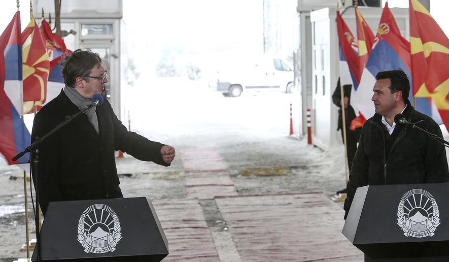 Serbia&#39;s President Aleksandar Vucic, left, and North Macedonia&#39;s Prime Minister Zoran Zaev, right, hold a news conference during a handover of COVID-19 vaccines, at the border crossing Tabanovce, between North Macedonia and Serbia, on Sunday, Feb. 14, 2021. Serbia which has launched a successful vaccination campaign has donated some 8,000 doses of Pfizer COVID-19 shots to North Macedonia which is yet to deliver its first shots. (AP Photo/Boris Grdanoski)