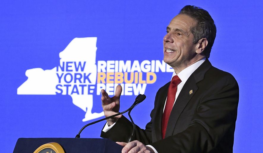 In this Jan. 11, 2021, photo, New York Gov. Andrew Cuomo delivers his State of the State address virtually from The War Room at the state Capitol, in Albany, N.Y. (AP Photo/Hans Pennink, Pool) **FILE**