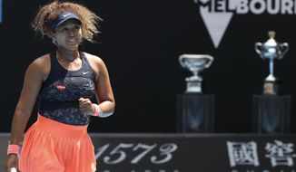Japan&#39;s Naomi Osaka reacts after defeating Taiwan&#39;s Hsieh Su-wei in their quarterfinal match at the Australian Open tennis championship in Melbourne, Australia, Tuesday, Feb. 16, 2021.(AP Photo/Hamish Blair)