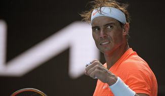 Spain&#39;s Rafael Nadal celebrates after defeating Italy&#39;s Fabio Fognini in their fourth round match at the Australian Open tennis championship in Melbourne, Australia, Monday, Feb. 15, 2021.(AP Photo/Andy Brownbill)