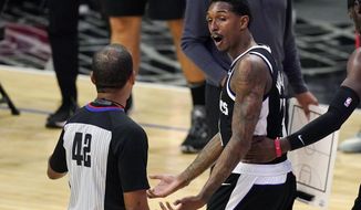 Los Angeles Clippers guard Lou Williams, right, agues with referee Eric Lewis before receiving a technical foul during the first half of an NBA basketball game against the Cleveland Cavaliers, Sunday, Feb. 14, 2021, in Los Angeles. (AP Photo/Mark J. Terrill)
