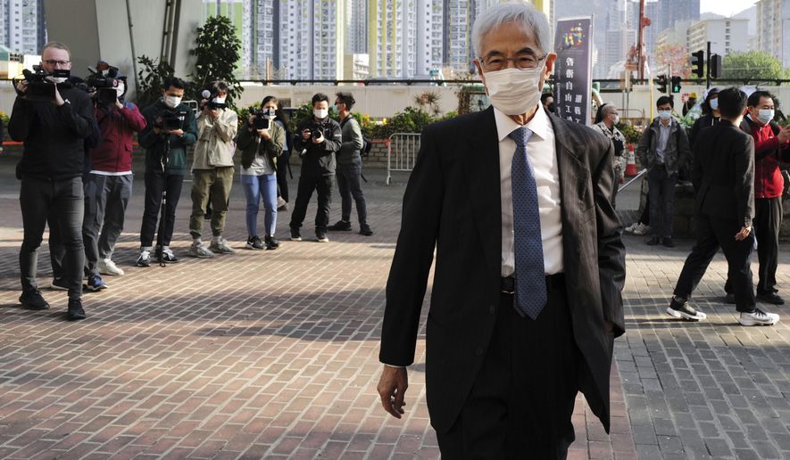 Pro-democracy lawmaker Martin Lee arrives at a court in Hong Kong Tuesday, Feb. 16, 2021. Nine prominent Hong Kong's democracy advocates faced trial Tuesday on charges of organizing an unauthorized assembly in August 2019. Among the defendants veteran octogenarian lawyer and dubbed Hong Kong's "father of democracy" Lee and media tycoon Jimmy Lai. (AP Photo/Vincent Yu)