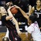Stanford forward Cameron Brink (22) has her shot blocked by Oregon forward Nyara Sabally (1) during the first half of an NCAA college basketball game Monday, Feb. 15, 2021, in Eugene, Ore. (AP Photo/Andy Nelson)