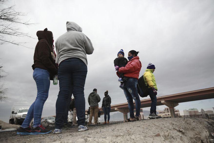 Honduran and Cuban migrants are questioned by Mexican migration authorities after attempting to cross the Rio Bravo on the border with the U.S., in Ciudad Juarez, Chihuahua state, Mexico, Tuesday, Feb. 16, 2021. The number of people apprehended at the U.S.-Mexico border has increased since Jan. with migrant families crossing from Ciudad Juarez and turning themselves over to Border Patrol. (AP Photo/Christian Chavez) **FILE**