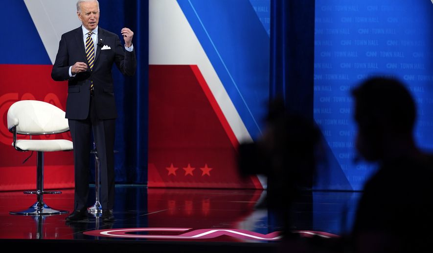 President Joe Biden talks during a televised town hall event at Pabst Theater, Tuesday, Feb. 16, 2021, in Milwaukee. (AP Photo/Evan Vucci)