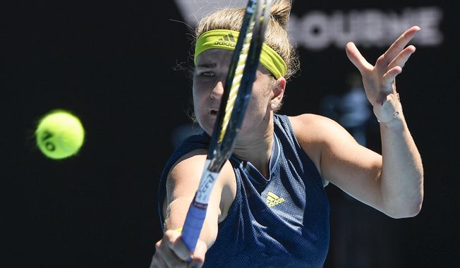 Karolina Muchova of the Czech Republic hits a backhand return to Australia&#x27;s Ash Barty during their quarterfinal match at the Australian Open tennis championship in Melbourne, Australia, Wednesday, Feb. 17, 2021.(AP Photo/Andy Brownbill)