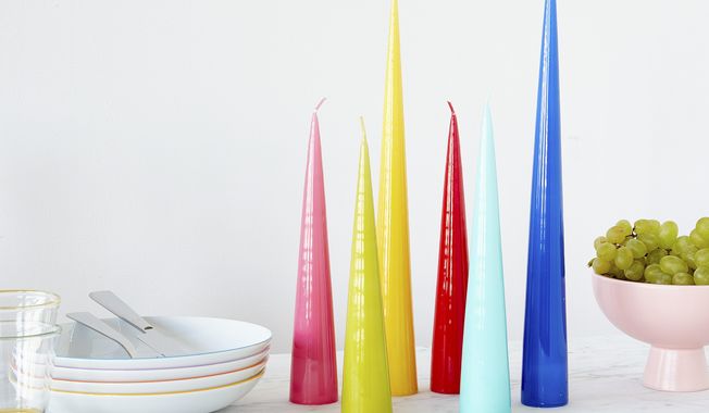 This image provided by MoMA Design Store shows a variety of cone candles. At the Museum of Modern Art&#x27;s design store, you can find Erik&#x27;s colorful cone-shaped candles don&#x27;t need holders; when they get down to about an inch, they just snuff out. (MoMA Design Store via AP)
