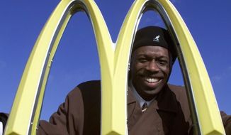 Herb Washington poses for a portrait outside his McDonalds restaraunt in Niles, Ohio, Thursday, Jan. 3, 2002. Washington, the Black owner of 14 McDonald&#39;s franchises in Ohio has sued the corporation in federal court asserting numerous instances of unfair treatment compared with white owners. Washington in his lawsuit filed Tuesday, Feb. 16, 2021 says the Chicago-based company has steered him over the years into buying franchises in low-income, majority Black communities while denying him the chance to buy stores in more affluent white locations. (AP Photo/Ron Schwane)