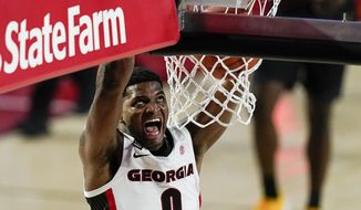 Georgia guard K.D. Johnson dunks during the second half of the team&#39;s NCAA college basketball game against Missouri, Tuesday, Feb. 16, 2021, in Athens, Ga. (AP Photo/Brynn Anderson)