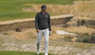 Jordan Spieth walks up to the 18th green of the Pebble Beach Golf Links during the final round of the AT&amp;amp;T Pebble Beach Pro-Am golf tournament Sunday, Feb. 14, 2021, in Pebble Beach, Calif. (AP Photo/Eric Risberg)