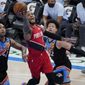 Portland Trail Blazers guard Damian Lillard (0) shoots between Oklahoma City Thunder center Al Horford (42) and center Isaiah Roby (22) in the second half of an NBA basketball game Tuesday, Feb. 16, 2021, in Oklahoma City. (AP Photo/Sue Ogrocki)