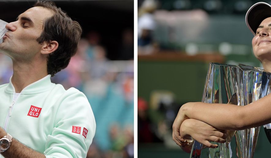 FILE - At left, in a March 31, 2019, file photo, Roger Federer, of Switzerland, kisses the trophy after defeating John Isner in the singles final of the Miami Open tennis tournament in Miami Gardens, Fla. At right, in a March 17, 2019, file photo, Bianca Andreescu, of Canada, smiles as she hugs her trophy after defeating Angelique Kerber, of Germany in the women's final at the BNP Paribas Open tennis tournament in Indian Wells, Calif. Roger Federer raised the prospect of merging the governing bodies that oversee the men’s and women’s professional tennis tours on Wednesday, April 22, 2020. The 20-time Grand Slam champion began a string of posts on Twitter by saying the shutdown of tennis because of the coronavirus outbreak has given the sport an ideal opportunity to assess its future. (AP Photo/File)