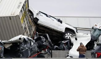 FILE - Vehicles are piled up after a fatal crash on Interstate 35 near Fort Worth, Texas on Thursday, Feb. 11, 2021. The National Transportation Safety Board said Tuesday, Feb. 16, 2021 that it will investigate a massive crash last week involving over 130 vehicles on an icy Texas highway that left six people dead and dozens injured. (Lawrence Jenkins/The Dallas Morning News via AP, file)