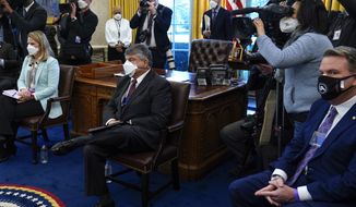 AFL-CIO president Richard Trumka, center, listens as President Joe Biden speaks during a meeting with labor leaders in the Oval Office of the White House, Wednesday, Feb. 17, 2021, in Washington. (AP Photo/Evan Vucci)