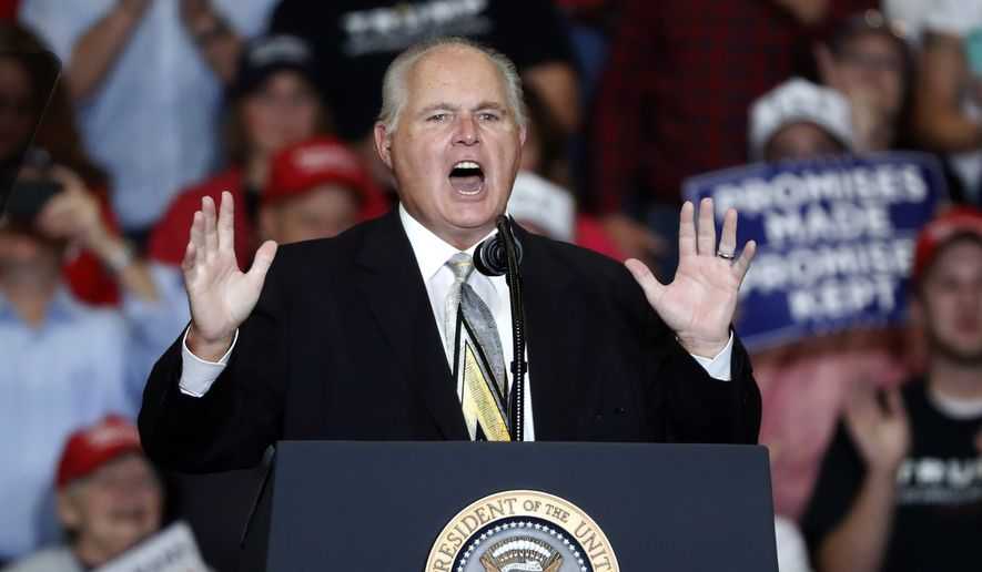 This Nov. 5, 2018, file photo shows radio personality Rush Limbaugh introducing President Donald Trump at the start of a campaign rally in Cape Girardeau, Mo. Limbaugh, the talk radio host who became the voice of American conservatism, has died. (AP Photo/Jeff Roberson, File)