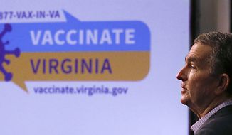 Virginia Gov. Ralph Northam addresses the public and the media while talking about the new website for Virginians to sign up for the COVID-19 vaccination during a press conference at the Patrick Henry Building in Richmond, Va., Wednesday, Feb. 17, 2021. (Bob Brown/Richmond Times-Dispatch via AP) **FILE**
