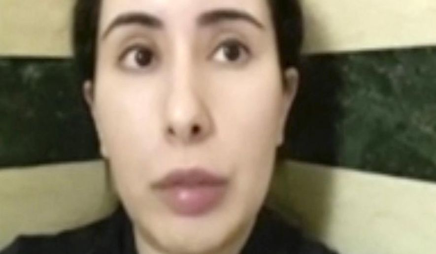 This undated image taken from video in an unknown location shows Sheikha Latifa bint Mohammed Al Maktoum speaking into a mobile phone camera. The United Nations’ human rights body said Wednesday Feb. 17, 2021, it will seek information from the United Arab Emirates about the daughter of Dubai’s powerful ruler after she said in video messages that she was being imprisoned in a heavily guarded villa. (#FreeLatifa campaign – Tiina Jauhiainen/David Haigh via AP)