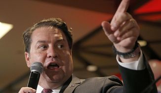 In this Nov. 4, 2014, file photo, Arizona then-Republican candidate for Attorney General Mark Brnovich talks to supporters at the Republican election night party in Phoenix. Brnovich ended the investigation into Republican Gov. Doug Ducey, saying he did not violate state law when he encouraged small business leaders to vote no on Proposition 208 last year. (AP Photo/Ross D. Franklin, File)