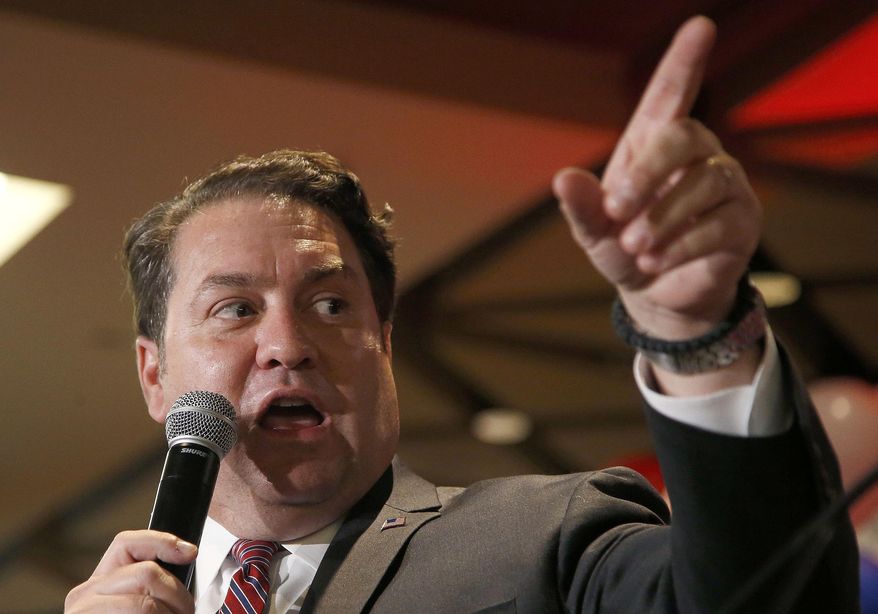 In this Nov. 4, 2014, file photo, Arizona then-Republican candidate for Attorney General Mark Brnovich talks to supporters at the Republican election night party in Phoenix. Brnovich ended the investigation into Republican Gov. Doug Ducey, saying he did not violate state law when he encouraged small business leaders to vote no on Proposition 208 last year. (AP Photo/Ross D. Franklin, File)