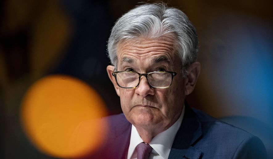 In this Dec. 1, 2020, file photo, Federal Reserve Chair Jerome Powell listens during a Senate Banking Committee hearing on Capitol Hill in Washington. (Al Drago/The New York Times via AP, Pool)