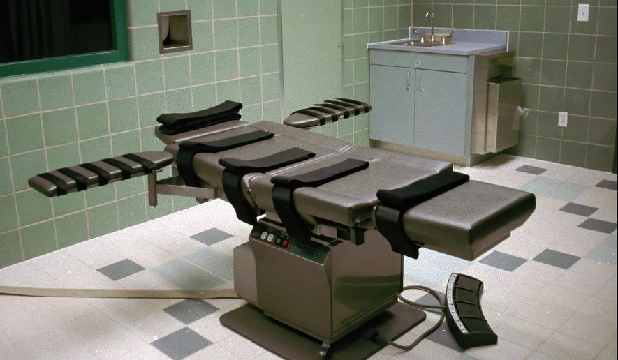 FILE - This March 22, 1995, file photo shows the interior of the execution chamber in the U.S. Penitentiary in Terre Haute, Ind. Executioners who put 13 inmates to death in the last months of the Trump administration likened the process of dying by lethal injection to falling asleep, called gurneys “beds” and final breaths “snores.” But those tranquil accounts are at odds with AP and other media-witness reports of how prisoners’ stomachs rolled, shook and shuddered as the pentobarbital took effect inside the U.S. penitentiary death chamber in Terre Haute, Indiana. (AP Photo/Chuck Robinson, File)