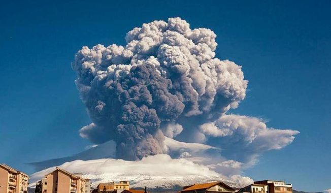 Smoke billows from Mount Etna, Europe’s most active volcano, Tuesday, Feb. 16, 2021. Mount Etna in Sicily, southern Italy,  has roared back into spectacular volcanic action, sending up plumes of ash and spewing lava. (Davide Anastasi/LaPresse via AP)