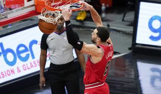 Chicago Bulls guard Zach LaVine dunks against the Detroit Pistons during the second half of an NBA basketball game in Chicago, Wednesday, Feb. 17, 2021. The Bulls won 105-102. (AP Photo/Nam Y. Huh)
