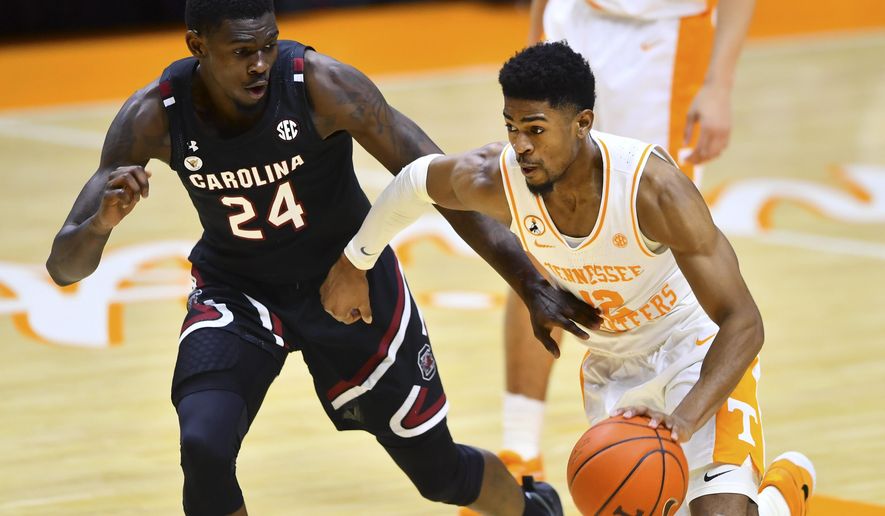 South Carolina&#39;s Keyshawn Bryant (24) defends against Tennessee&#39;s Victor Bailey Jr. (12) during an NCAA college basketball game Wednesday, Feb. 17, 2021, in Knoxville, Tenn. (Brianna Paciorka/Knoxville News Sentinel via AP, Pool)