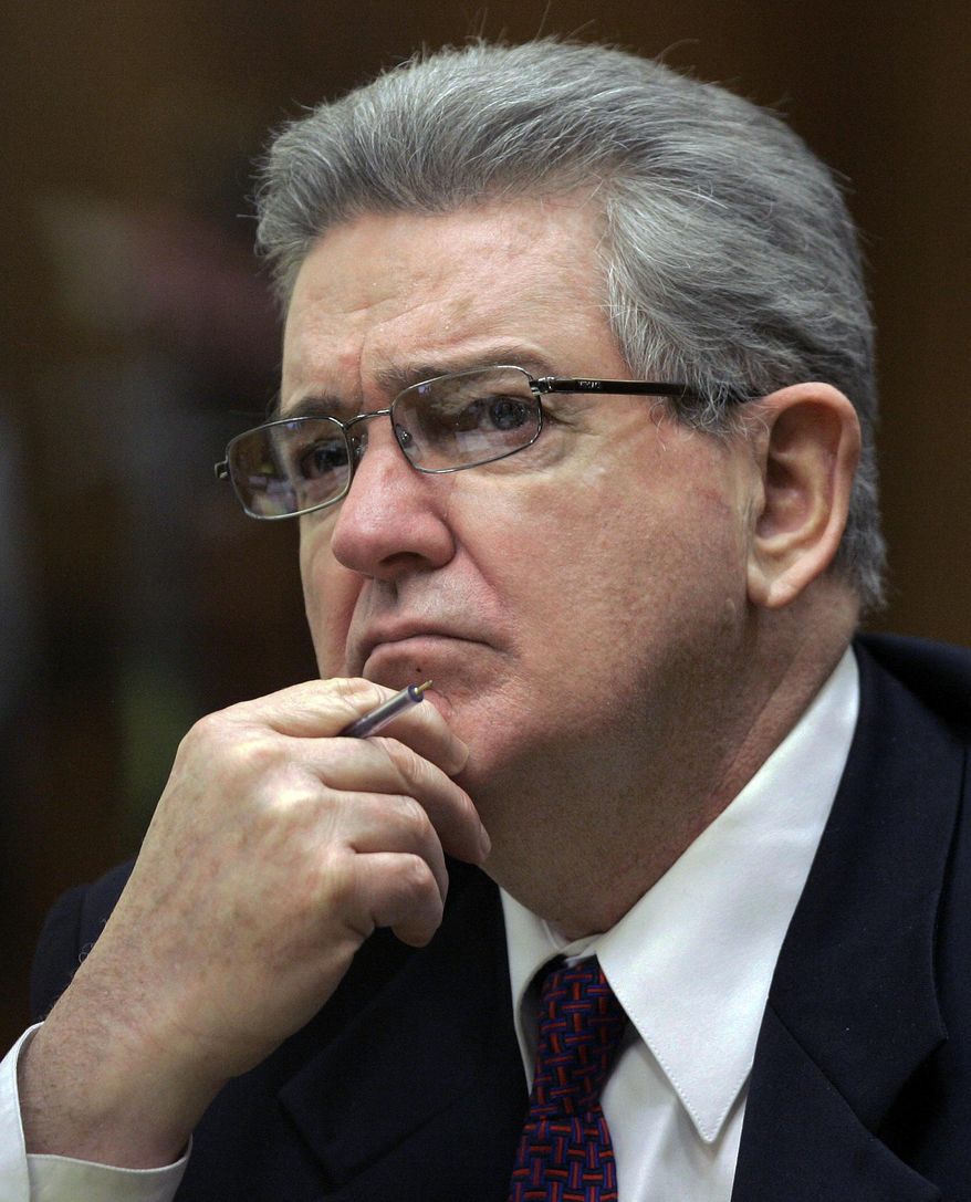 FILE- In this Oct. 15, 2008 file photo, former FBI agent John Connolly listens to the testimony during his trial in Miami. The imprisoned former FBI agent serving a 40-year prison sentence for alerting former Boston mobster Whitey Bulger that he could implicated in a mob murder wants to be released from prison on medical grounds. Connolly will ask the Florida Commission on Offender Review Wednesday, Feb. 17, 2021 to release him. (AP Photo/Alan Diaz, File)