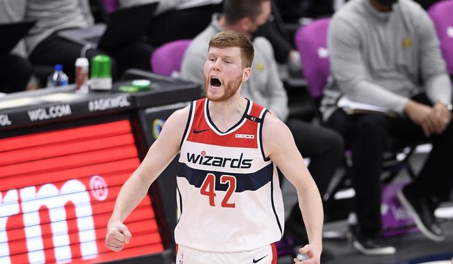 Washington Wizards forward Davis Bertans (42) reacts after he made a three-point basket during the second half of an NBA basketball game against the Denver Nuggets, Wednesday, Feb. 17, 2021, in Washington. (AP Photo/Nick Wass) **FILE**