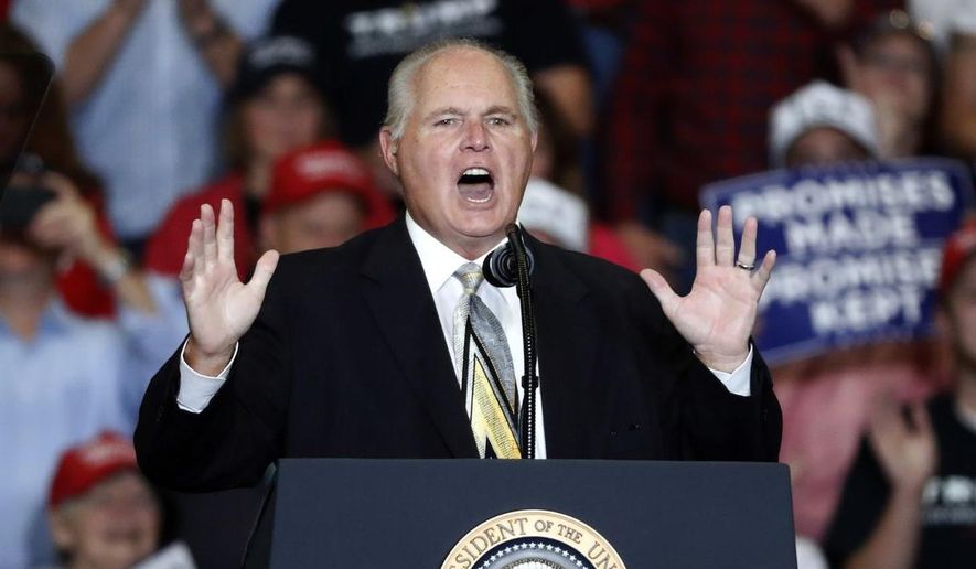 This Nov. 5, 2018, file photo shows radio personality Rush Limbaugh introducing President Donald Trump at the start of a campaign rally in Cape Girardeau, Mo. Limbaugh, the talk radio host who became the voice of American conservatism, has died. (AP Photo/Jeff Roberson, File)