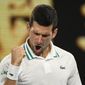 Serbia&#39;s Novak Djokovic celebrates after defeating Russia&#39;s Aslan Karatsev in their semifinal match at the Australian Open tennis championship in Melbourne, Australia, Thursday, Feb. 18, 2021..(AP Photo/Andy Brownbill)