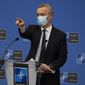 NATO Secretary General Jens Stoltenberg wears a protective face mask as he prepares to speak during a media conference, after a meeting of NATO defense ministers in video format, at NATO headquarters in Brussels on Thursday, Feb. 18, 2021. (AP Photo/Virginia Mayo, Pool)