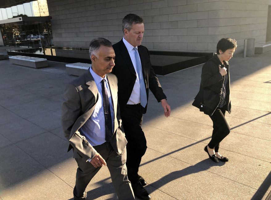 FILE - In this Friday, Nov. 22, 2019 file photo, Imaad Zuberi, left, leaves a federal courthouse with his attorney Thomas O&#39;Brien, second from left, in Los Angeles. On Thursday, Feb. 18, 2021, Zuberi, a once high-flying political fundraiser who prosecutors say gave illegal campaign contributions to Joe Biden, Lindsey Graham and a host of other U.S. politicians while secretly working for foreign governments is set to be sentenced. (AP Photo/Brian Melley)