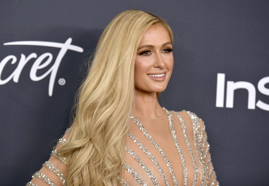 FILE - Paris Hilton arrives at the InStyle and Warner Bros. Golden Globes afterparty on Jan. 5, 2020, in Beverly Hills, Calif. Hilton announced her engagement to entrepreneur Carter Reum in her social media post on Wednesday, Feb. 17, 2021, the same day as her birthday. (Richard Shotwell/Invision/AP, File)