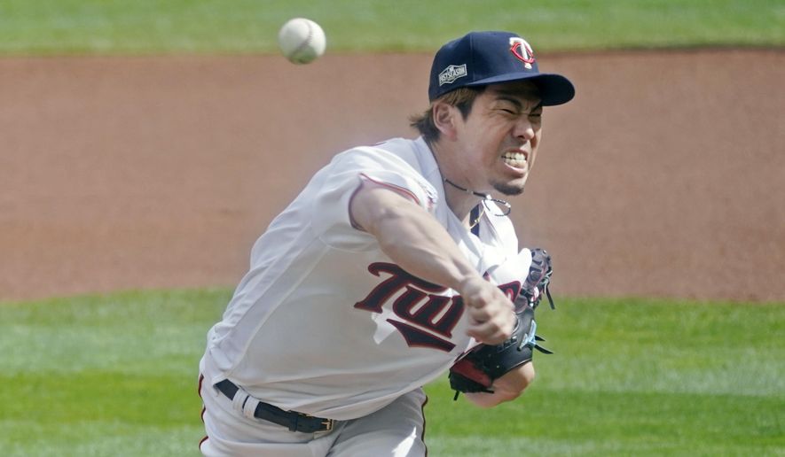FILE - Minnesota Twins pitcher Kenta Maeda of Japan throws against the Houston Astros in the first inning of an American League playoff baseball game in Minneapolis, in this Tuesday, Sept 29, 2020, file photo. Maeda&#39;s first season in Minnesota, albeit abbreviated by the pandemic, was a runaway success. The Japanese right-hander who has averaged 120 innings over the past four years, will have his durability tested in 2021. (AP Photo/Jim Mone, File)