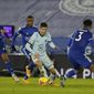 Chelsea&#x27;s Christian Pulisic, center, tries to dribble past Leicester&#x27;s Youri Tielemans, left, and Wesley Fofana, right, during the English Premier League soccer match between Leicester City and Chelsea at the King Power Stadium in Leicester, England, Tuesday, Jan. 19, 2021. Leicester City won the match 2-0. (Tim Keeton/Pool via AP)