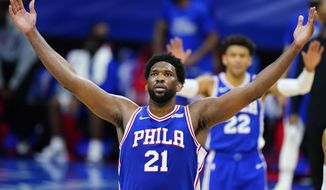 Philadelphia 76ers&#39; Joel Embiid reacts after a basket during the second half of an NBA basketball game against the Chicago Bulls, Friday, Feb. 19, 2021, in Philadelphia. (AP Photo/Matt Slocum)
