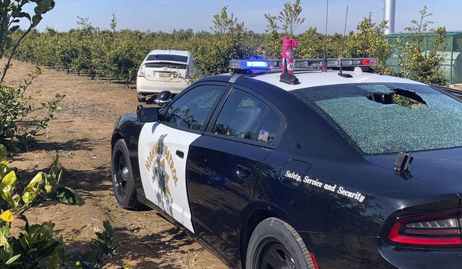 This photo provided by the Tulare County Sheriff&#x27;s Office shows a shot out rear window of a California Highway Patrol vehicle in Exeter, Calif., in Tulare County, in central California, Friday, Feb. 19, 2021. Authorities say a California Highway Patrol officer and a suspect were struck by bullets during a shootout in Exeter in the San Joaquin Valley after a vehicle pursuit. The Tulare County Sheriff&#x27;s Office says Friday that the CHP officer was hit in the shoulder and is expected to survive her injuries. (Tulare County Sheriff&#x27;s Office via AP )