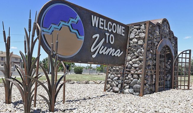 In this May 23, 2019, photo, is a &quot;Welcome to Yuma&quot; sign in Yuma, Ariz. Overwhelmed border officials have started releasing migrants into Arizona&#x27;s rural Yuma County as more people arrive amid the coronavirus pandemic with hopes of making their home in America. Yuma Mayor Douglas Nicholls says the U.S. Border Patrol on Monday, Feb. 15, 2021, released a group of 20 people in the neighboring community of San Luis and that several similarly sized groups were let out later in the week. (Randy Hoeft/Yuma Sun via AP) **FILE**
