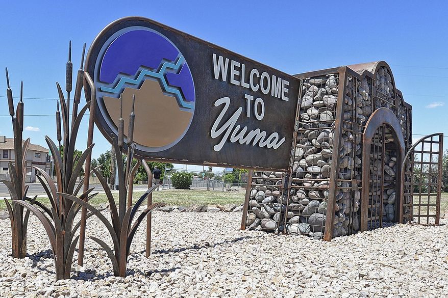 In this May 23, 2019, photo, is a &quot;Welcome to Yuma&quot; sign in Yuma, Ariz. Overwhelmed border officials have started releasing migrants into Arizona&#39;s rural Yuma County as more people arrive amid the coronavirus pandemic with hopes of making their home in America. Yuma Mayor Douglas Nicholls says the U.S. Border Patrol on Monday, Feb. 15, 2021, released a group of 20 people in the neighboring community of San Luis and that several similarly sized groups were let out later in the week. (Randy Hoeft/Yuma Sun via AP) **FILE**